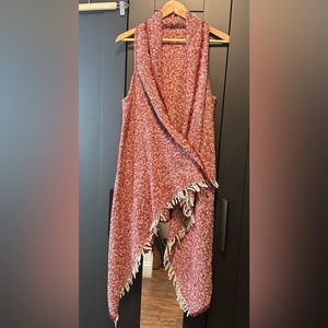 Francesca’s sleeveless asymmetrical sweater